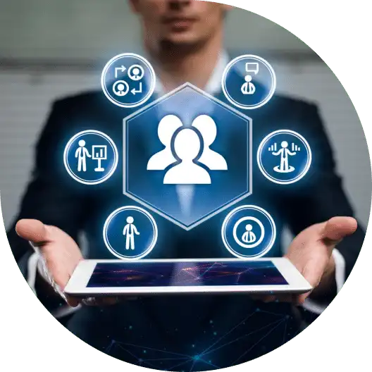 Businessperson holding a tablet with icons representing human resources and personnel management concepts floating above it.